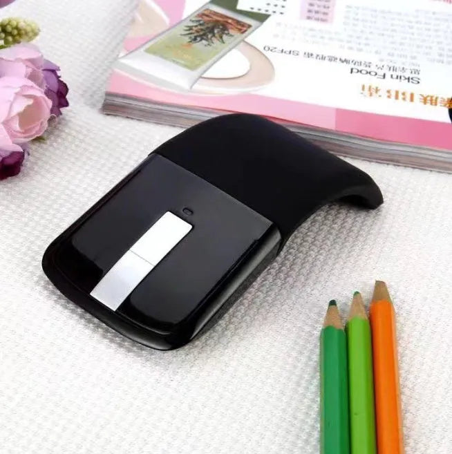 Black Bluetooth 4.0 folding touch wireless mouse shown in compact and folded position.