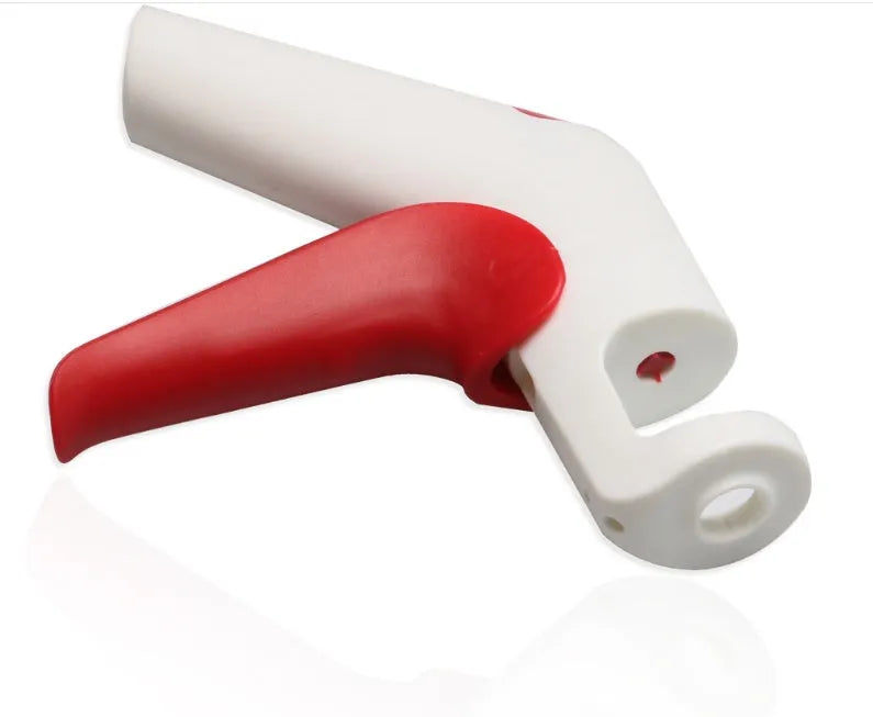 Stainless steel manual cherry kernel remover tool with ergonomic handle and spare pins.
