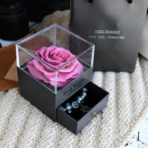Eternal Flower gift box with preserved roses and carnations inside, measuring 8.5 cm square by 10.5 cm high