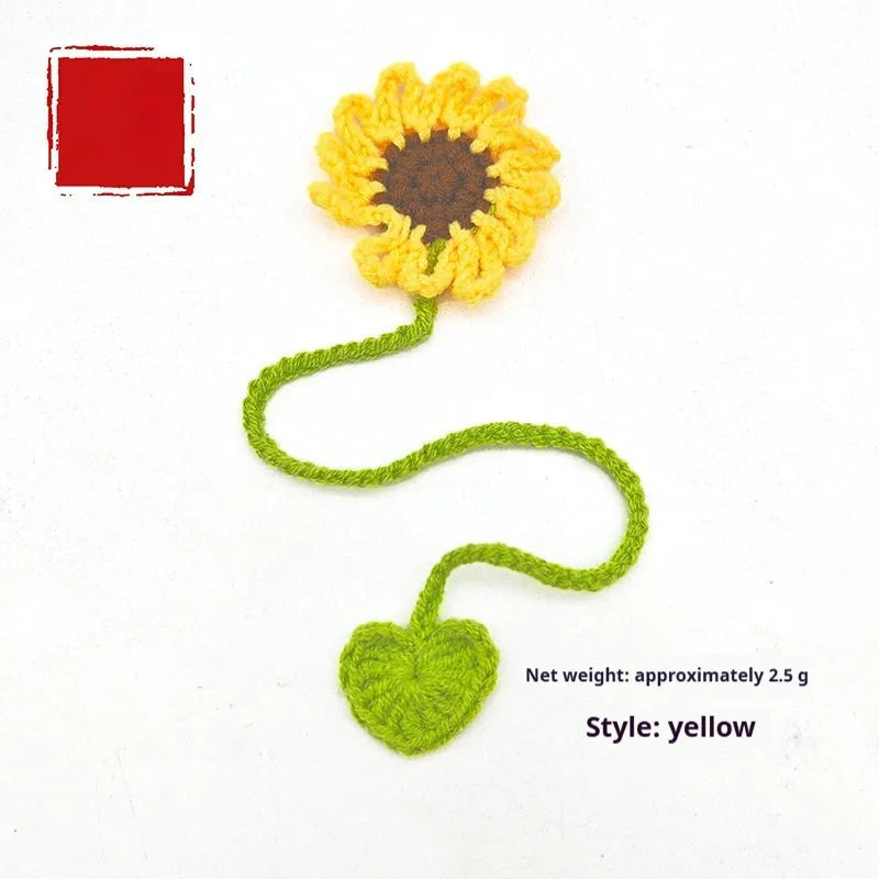 Hand-crocheted wool bookmark with flexible wire core and little daisy design in milk cotton yarn