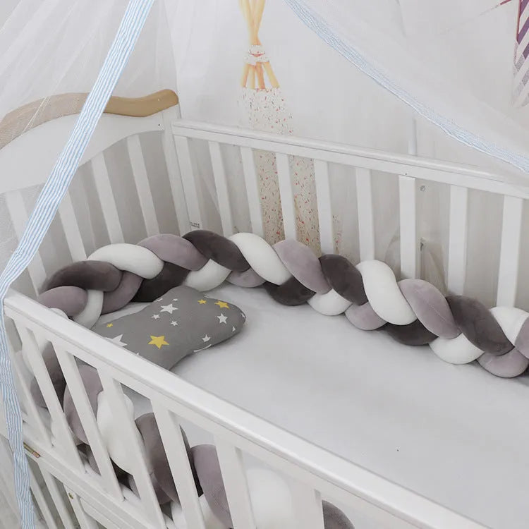 Braided knot crib bumper in spandex velvet, showing flexible length options for cot protection.