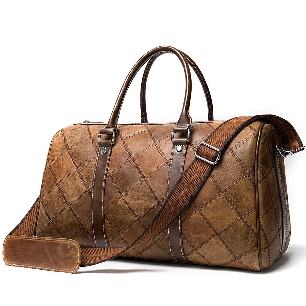 Vintage brown cowhide leather duffel bag with single shoulder strap showing internal organisation compartments