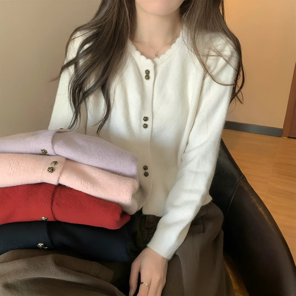 Women's long-sleeved acrylic cardigan coat in a solid colour, shown with a regular fit and cardigan front.