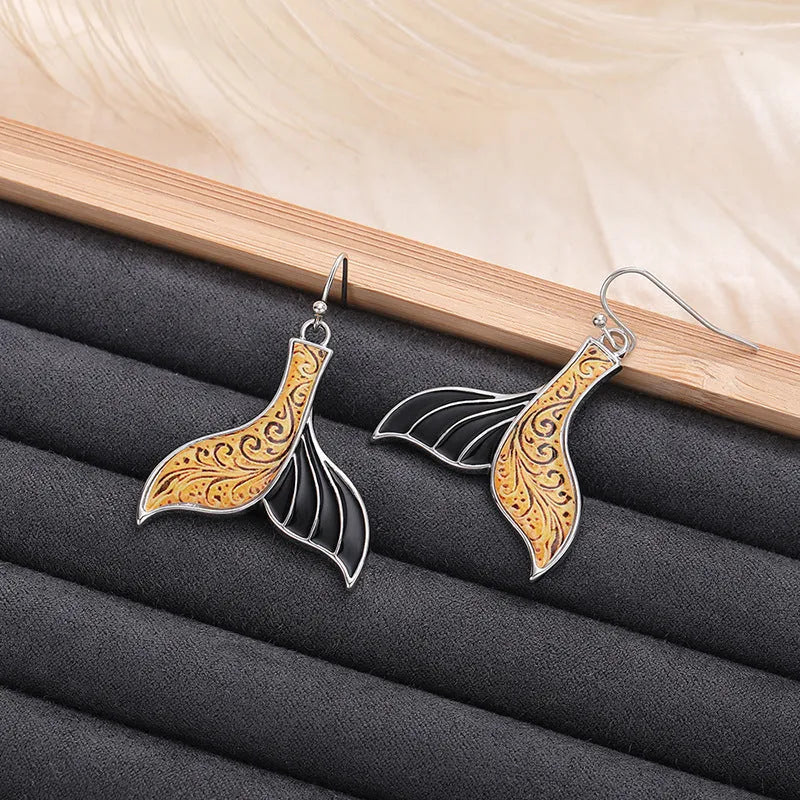 Women's white gold colour fishtail earrings with whale design