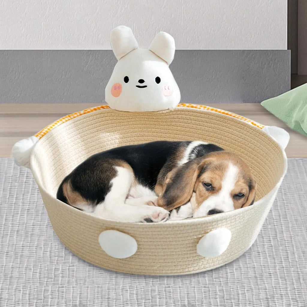 Woven cotton rope basket serving as a cat bed and scratcher in a natural colour.