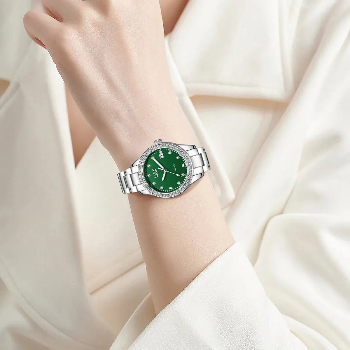 Silver fashion watch with diamond dial, luminous hands, and stainless steel case.
