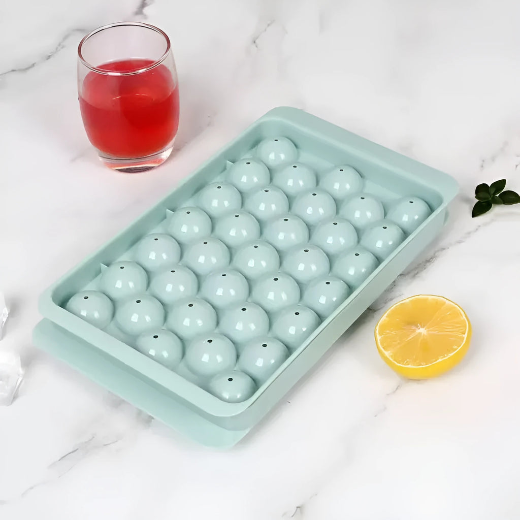 Blue silicone ice cube tray with lid showing 33 round compartments