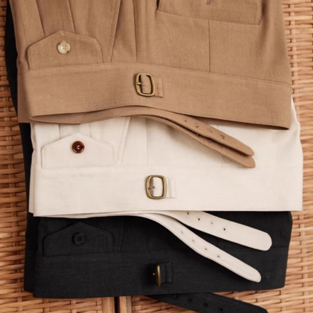 Men's slim fit straight leg business trousers in light brown colour, showing wrinkle resistant polyester fabric.
