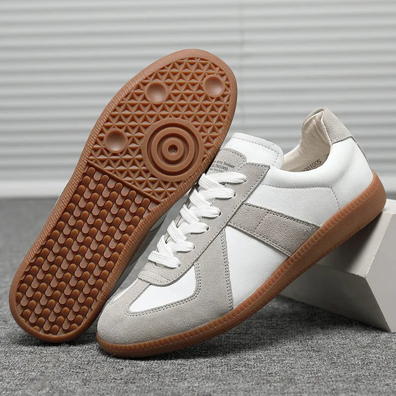 White Japanese-inspired retro unisex sneakers with low-top lace-up design on a rubber sole