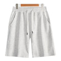 Cotton straight-leg summer shorts in light grey shown on a hanger