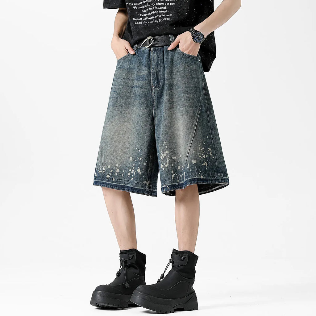 Men's retro blue denim shorts with splash ink pattern and ripped straight-leg design