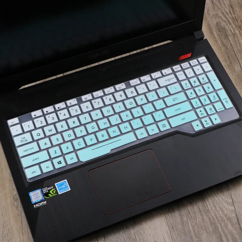 Clear protective keyboard film cover for ASUS Flight 14-inch laptop on a keyboard.