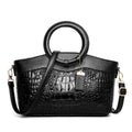 Ladies casual fabric handbag in multiple colours with zipper compartments, shown with shoulder strap.