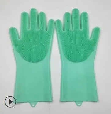 Blue silicone scrubbing gloves showing textured palm and finger surfaces for cleaning