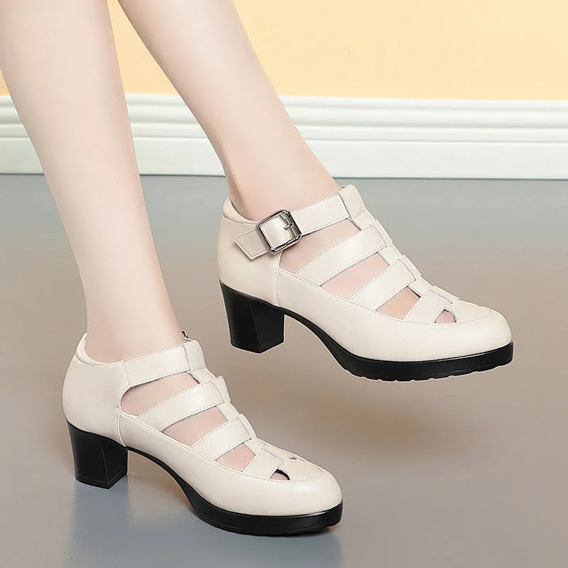Women's beige closed toe sandals with chunky heel, woven pattern, buckle ankle strap, and back zipper.