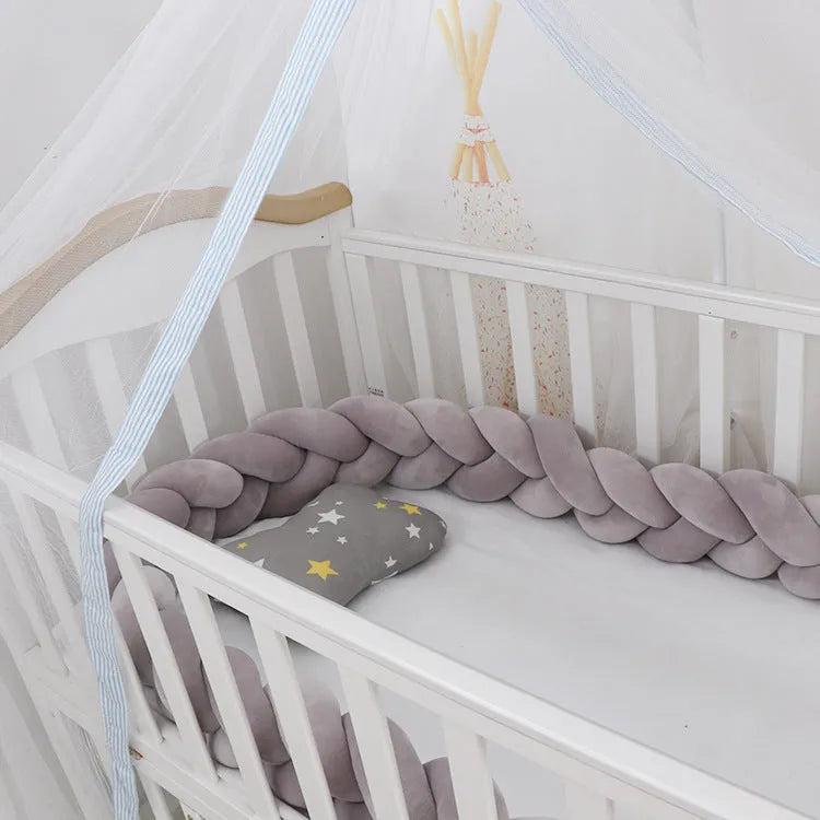 Braided knot crib bumper in spandex velvet, showing flexible length options for cot protection.