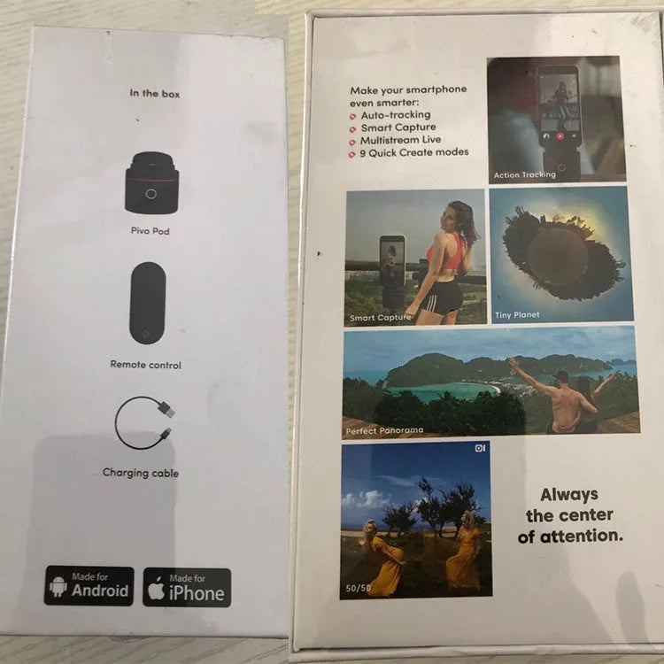 Black PIVO facial tracking camera for smartphones on a table, showing its matte finish.