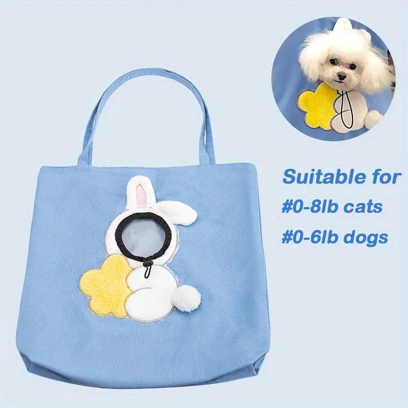 Little Bee Design canvas pet carrier shoulder bag with safety zippers and an adjustable elastic head opening for a cat or small dog.