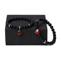 Natural stone couple bracelet set showing two matching bracelets with heart-shaped polished stone charms