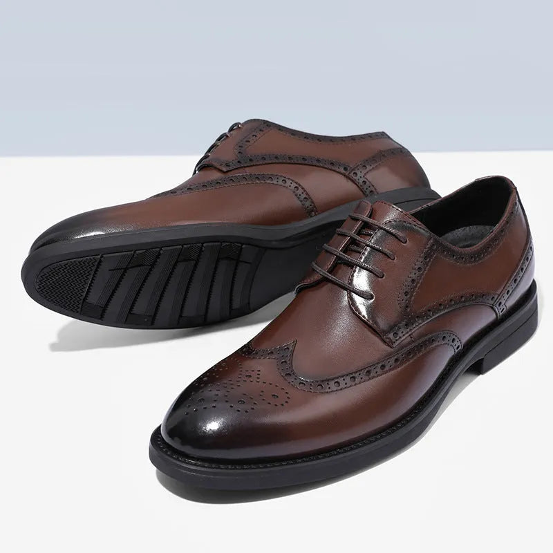 Men's black brogue leather shoes with traditional perforations and Oxford-style construction