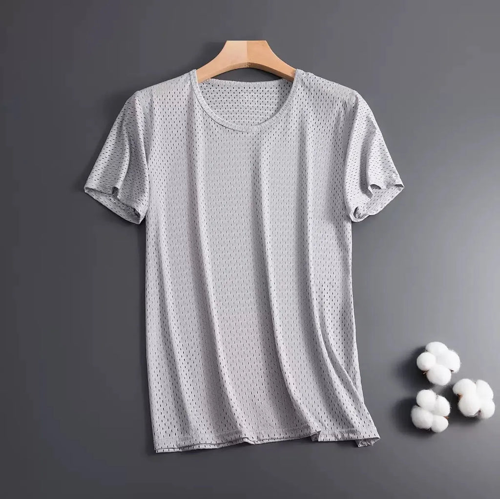Man wearing a thin grey Ice Silk short sleeve crew neck t-shirt with a loose fit.