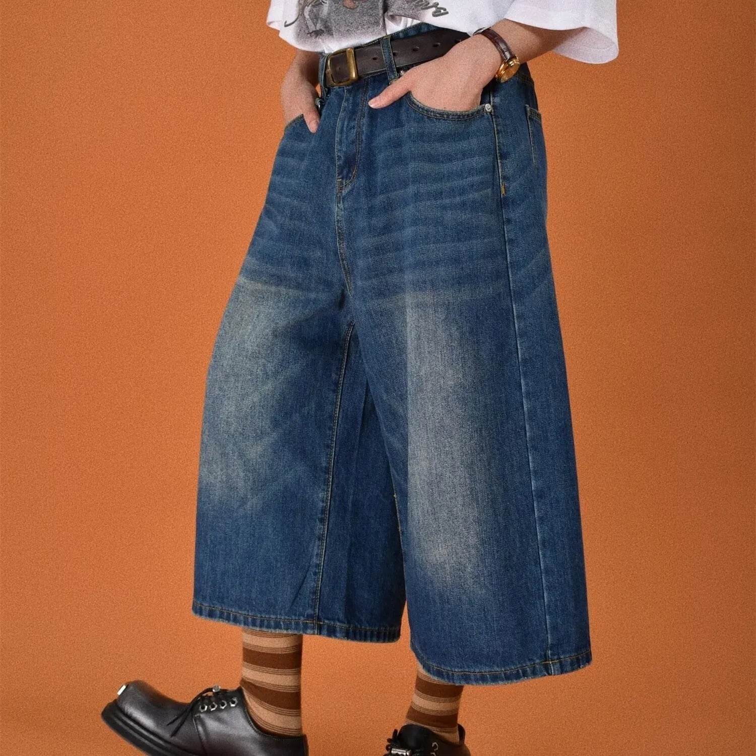 Men's straight-leg denim shorts in blue, shown with a loose fit for summer.