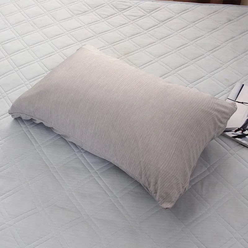 Blue and grey cooling blanket with Japanese Q-Max fibres on a bed.