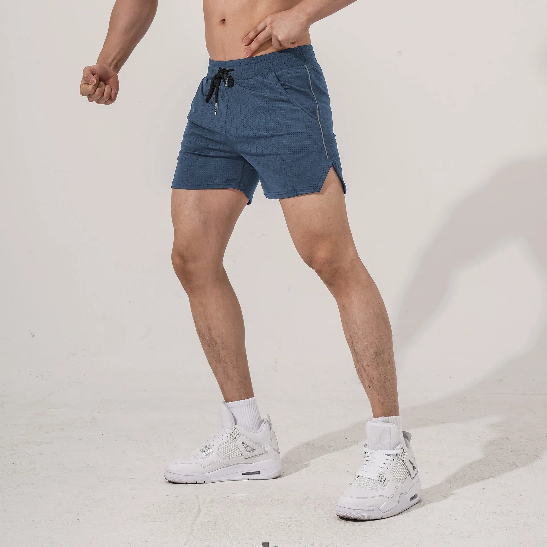 Men's straight leg sports shorts in polyester fabric available in multiple colours