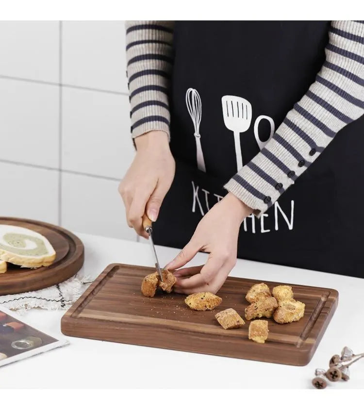 Black walnut wood cutting board with juice groove and side handle shown in three size options