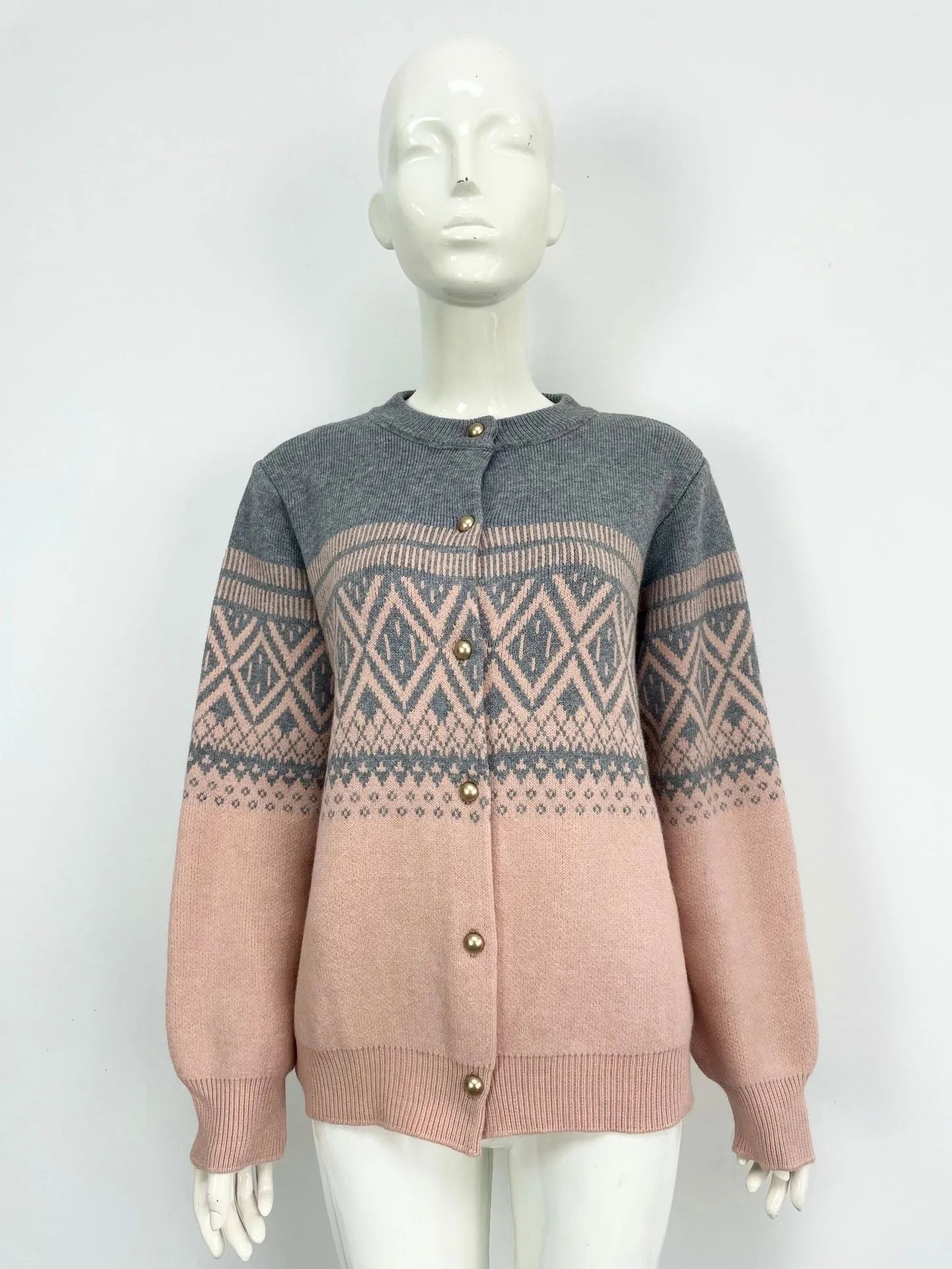 Women's red alpaca wool cardigan with diamond knit pattern and contrast colour long sleeves.