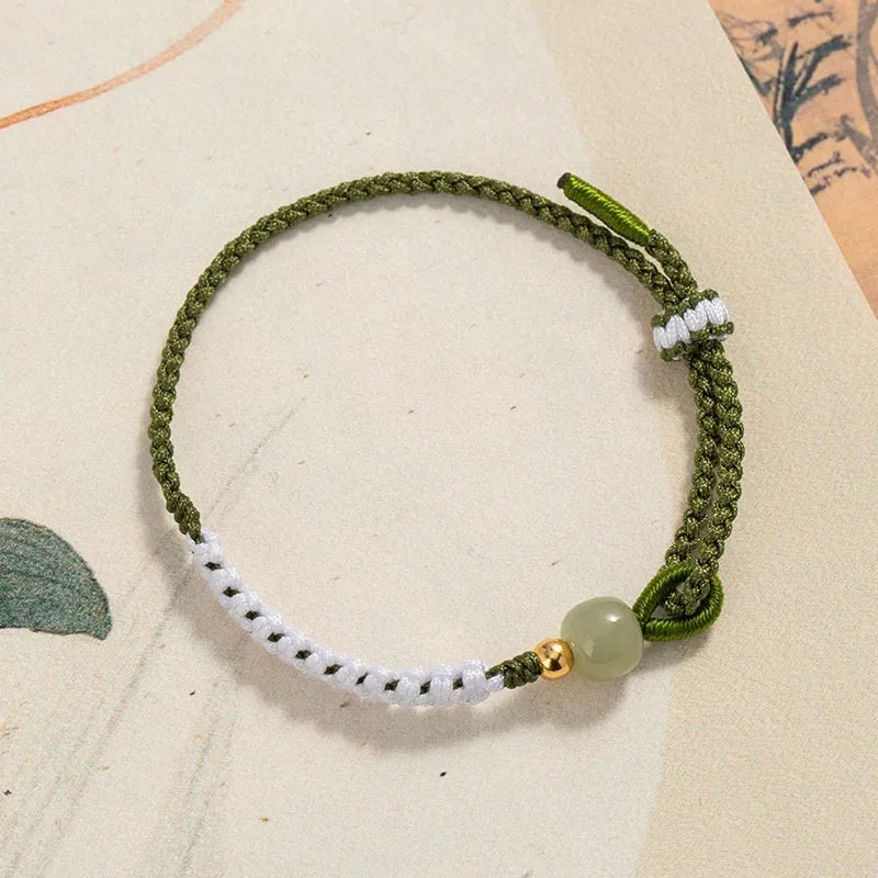 Women's Chinese national bracelet with adjustable cord carrying strap in electroplated finish