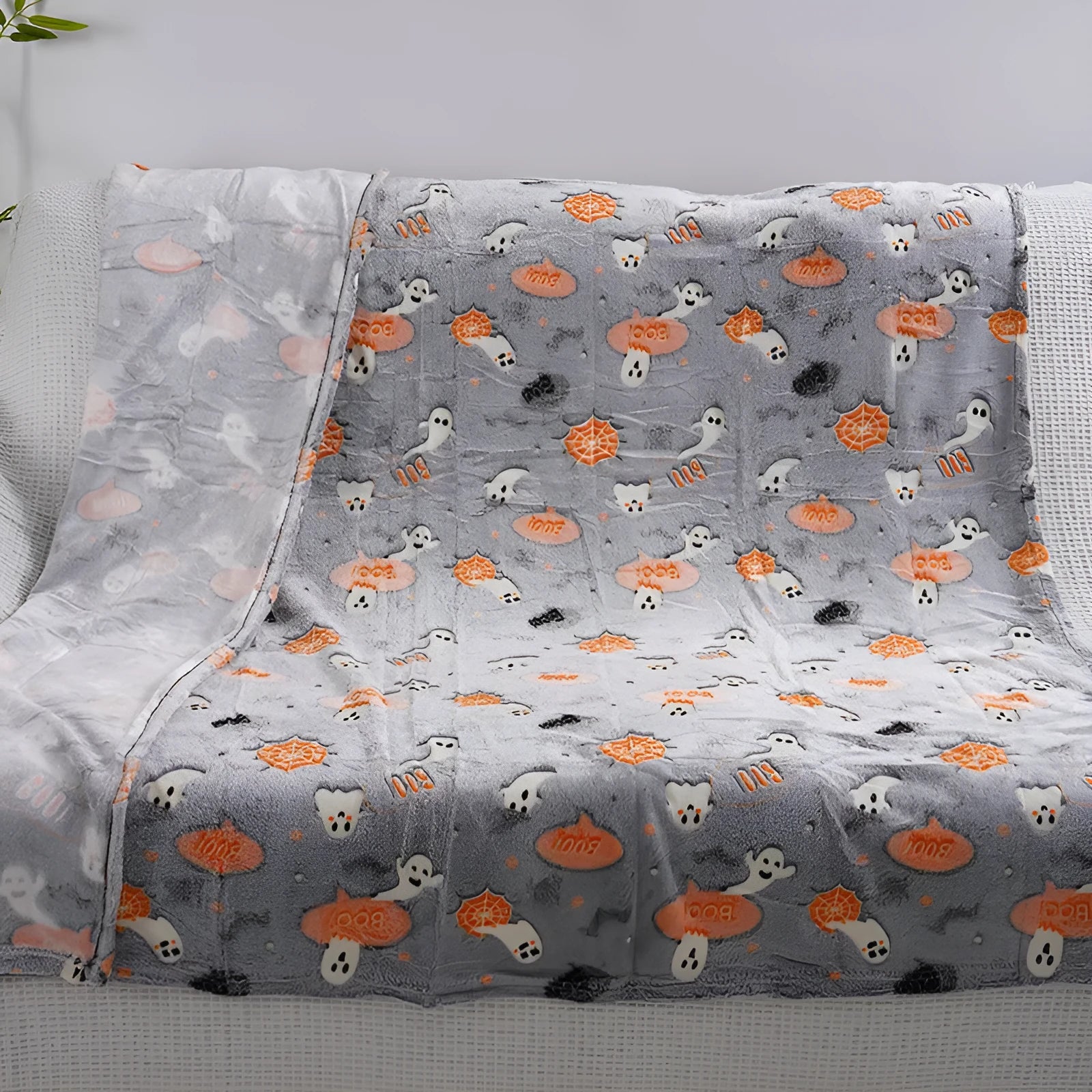 Children's cartoon flannel blanket in colourful design on bed