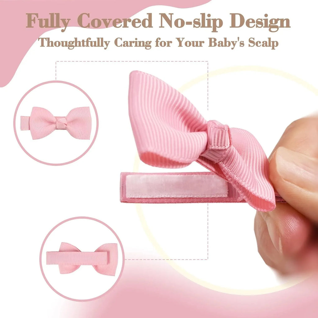 Assortment of pastel-coloured barrette and bow hair clips for babies on a white background.