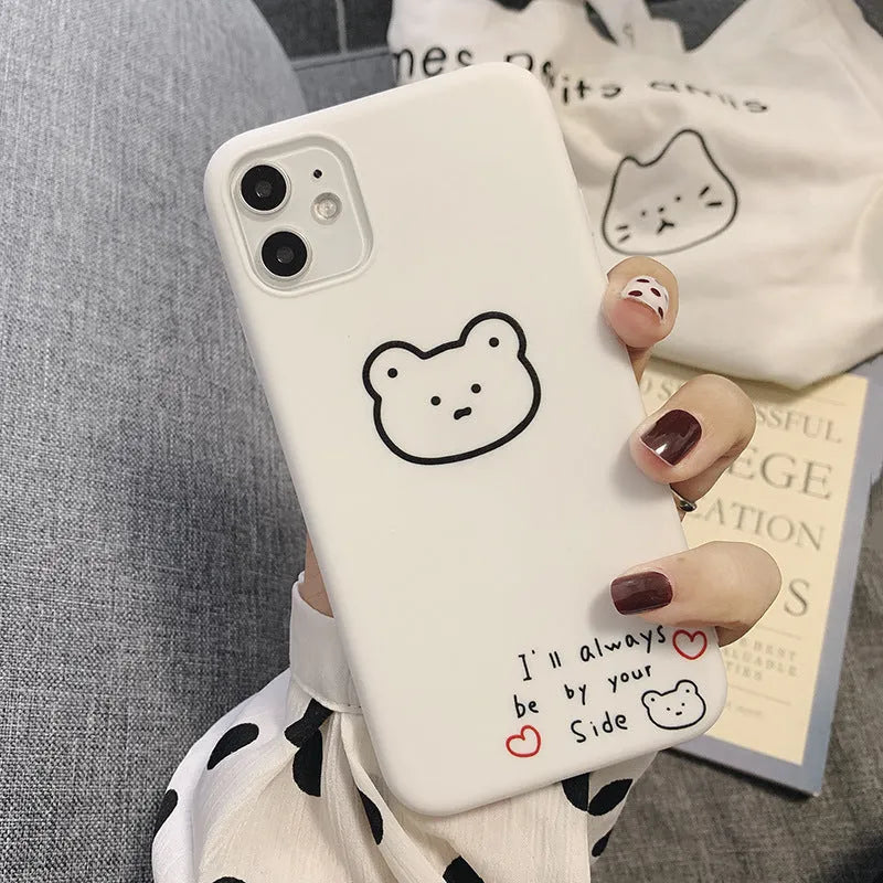 Soft silicone Apple iPhone case with a Korean cartoon bear design on the back.