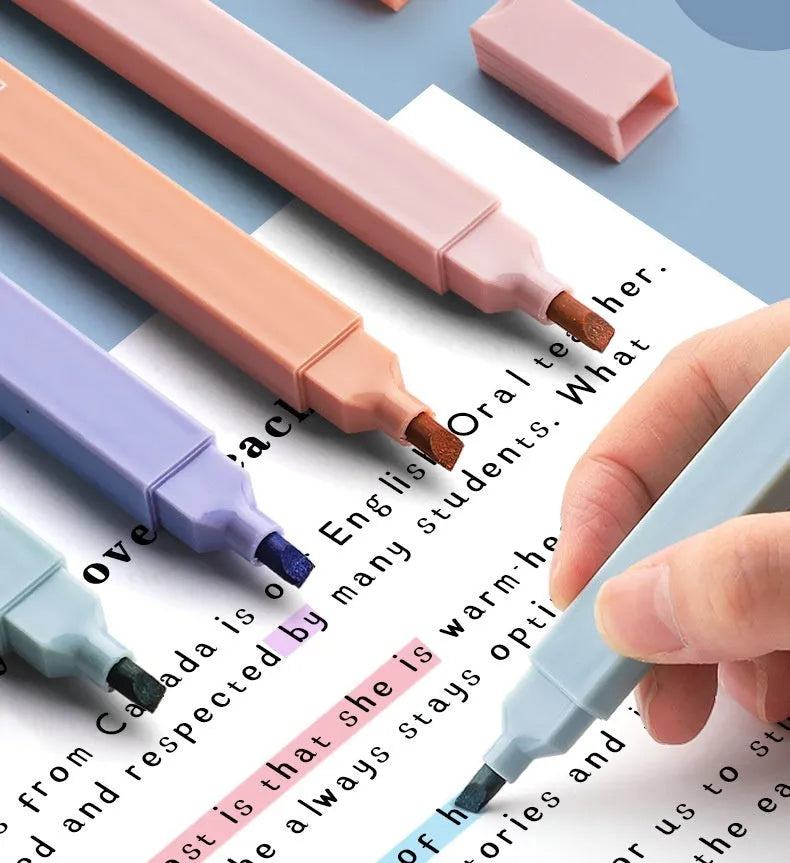 Fluorescent double-headed marking pens in mixed colour assortment with both broad and fine tips visible.
