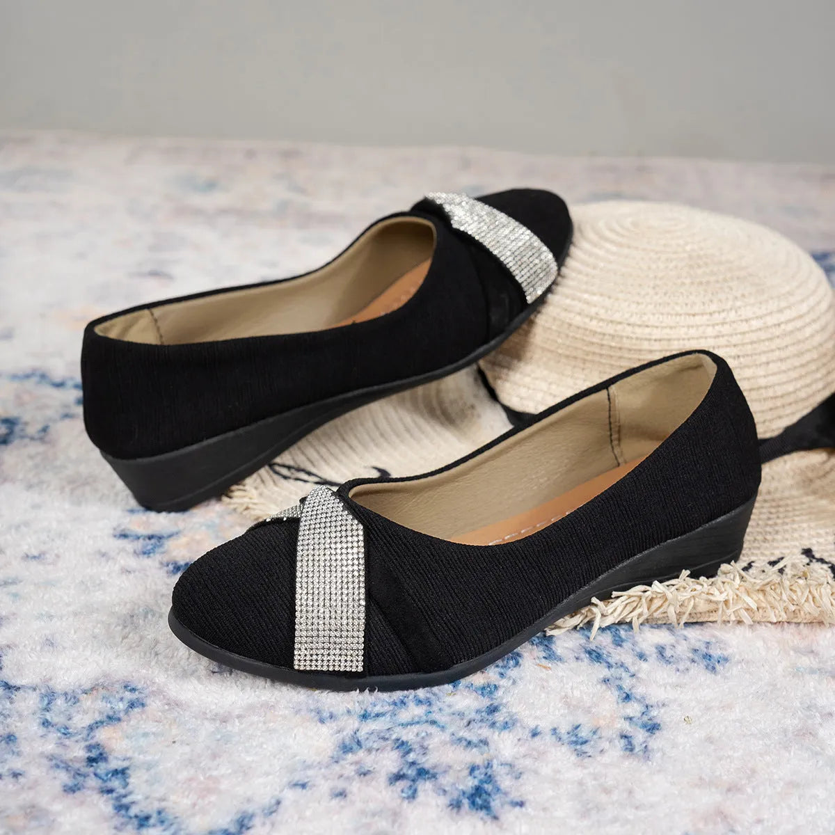 Black women's slip-on casual shoes with a chunky heel and rhinestone decoration on the fabric upper.