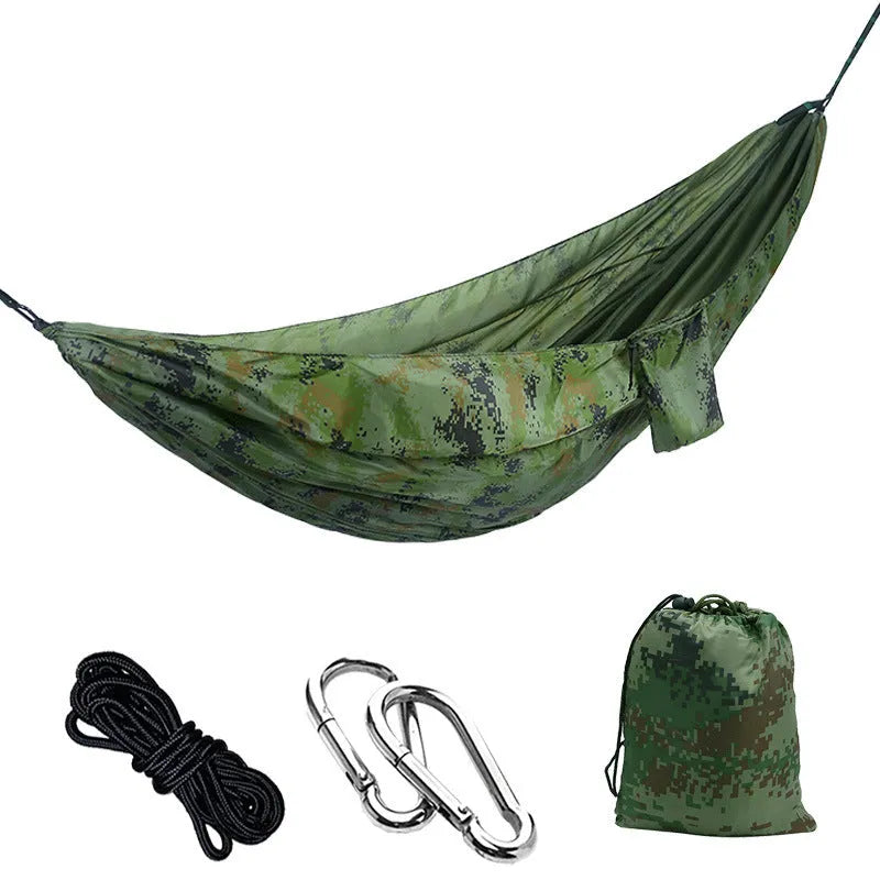 Double camping hammock with ropes and buckles shown in outdoor setting