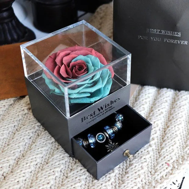 Eternal Flower gift box with preserved roses and carnations inside, measuring 8.5 cm square by 10.5 cm high