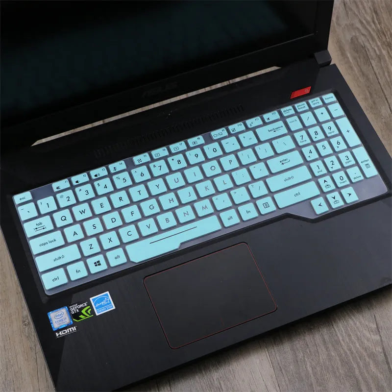 Clear protective keyboard film cover for ASUS Flight 14-inch laptop on a keyboard.