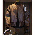 Men's black PU leather jacket with litchi texture and extended 100cm length in slim fit.