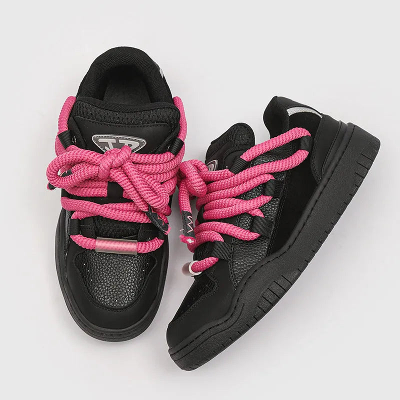 Casual low-top lace-up shoes in a solid colour with a round toe and thick rubber sole.