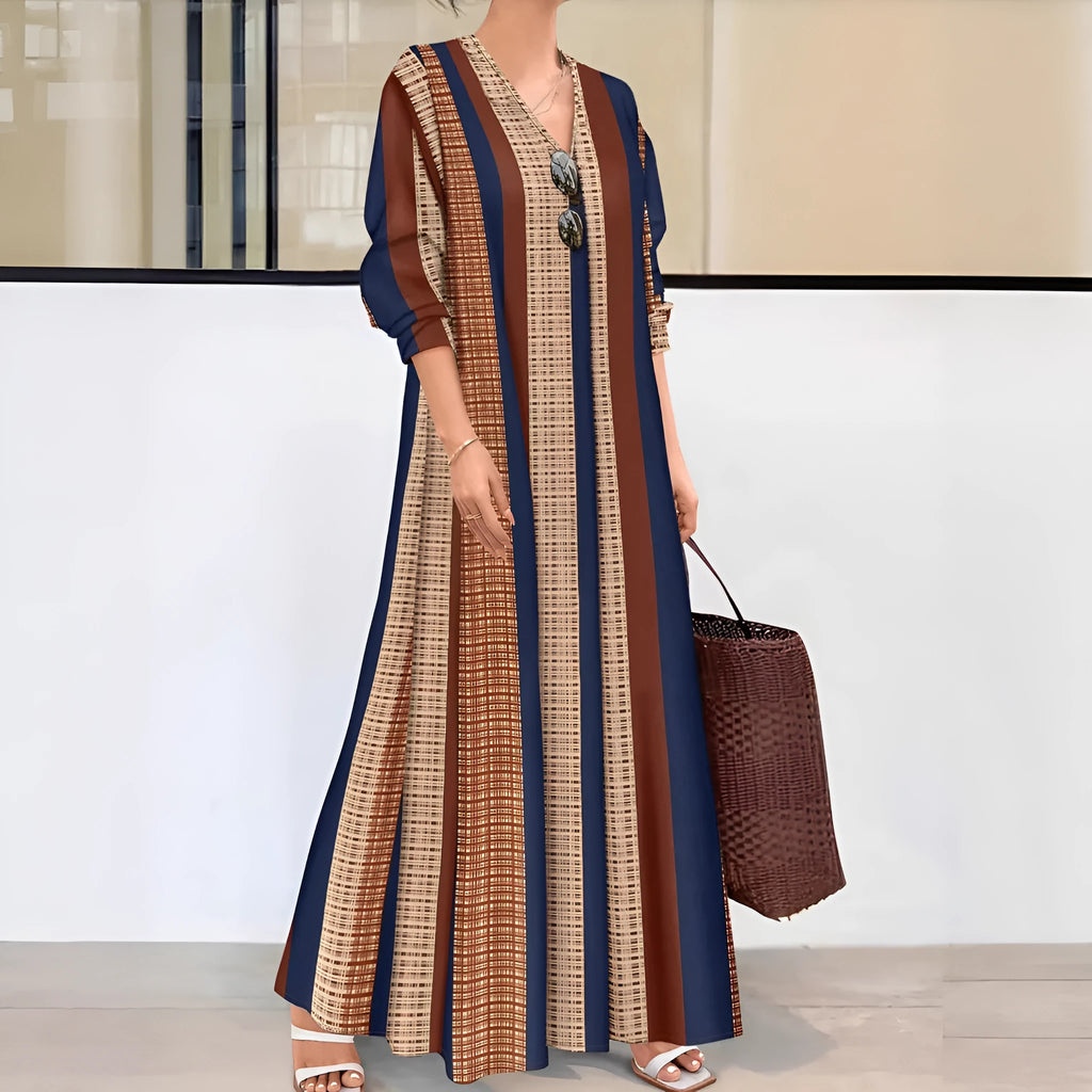 Camel coloured women's casual dress with vertical stripes, V-neck, and long A-line skirt.