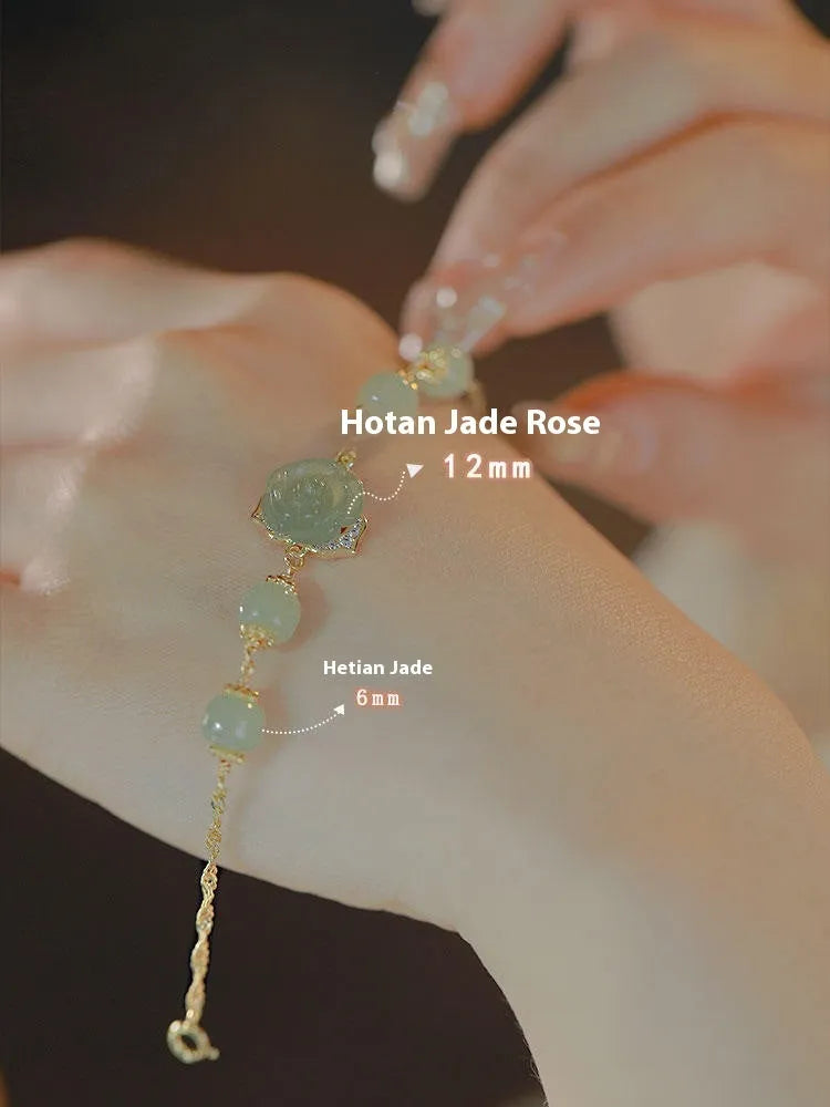Women's Hetian Jade bracelet with carved rose design and 14K gold gilding on floral-shaped band