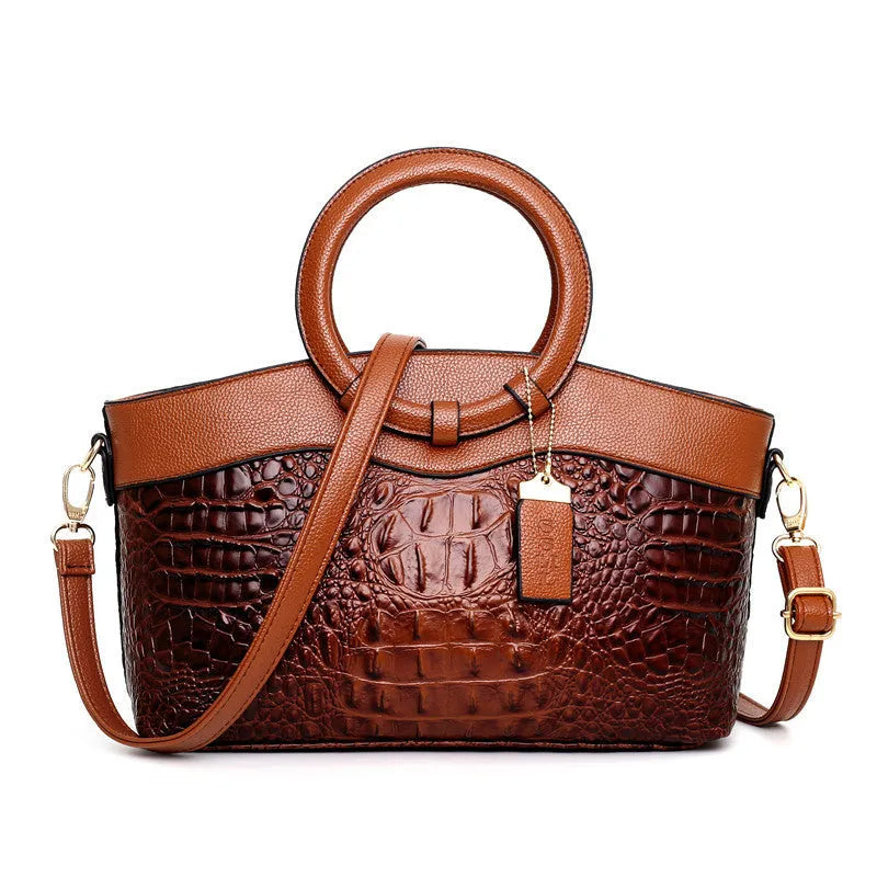 Ladies casual fabric handbag in multiple colours with zipper compartments, shown with shoulder strap.