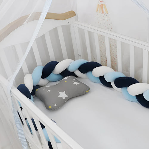 Braided knot crib bumper in spandex velvet, showing flexible length options for cot protection.