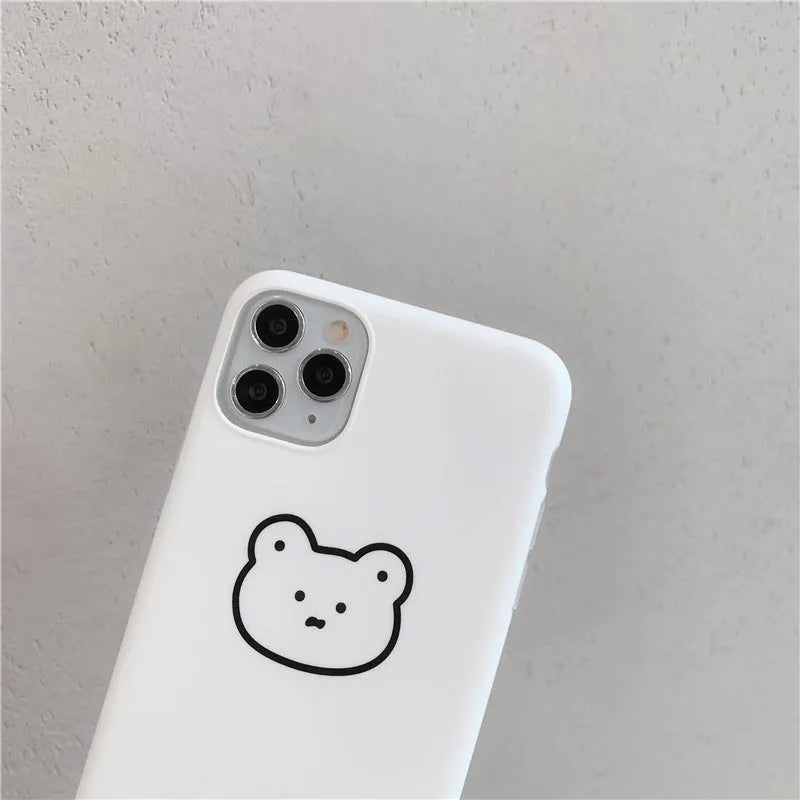 Soft silicone Apple iPhone case with a Korean cartoon bear design on the back.
