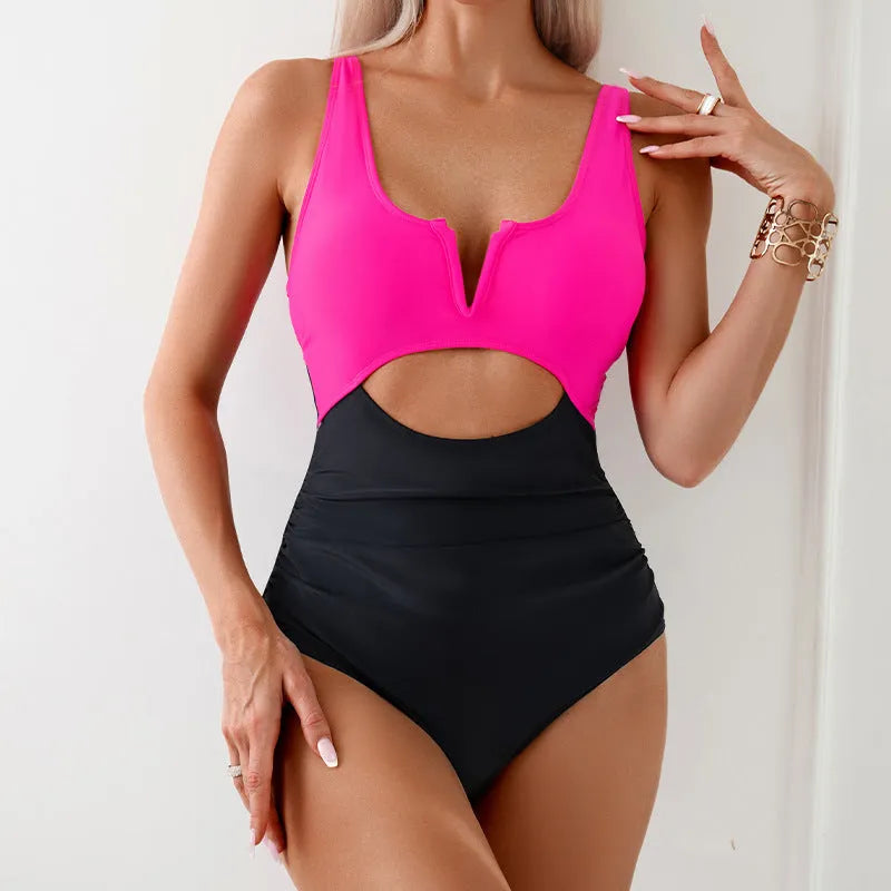 Women's one-piece swimsuit with contrast colour panels in green, black, dark pink or brown.