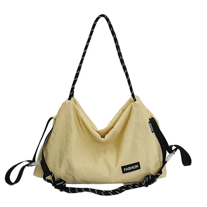 Large capacity soft cloth crossbody bag in beige with sewn detail, available in six colours