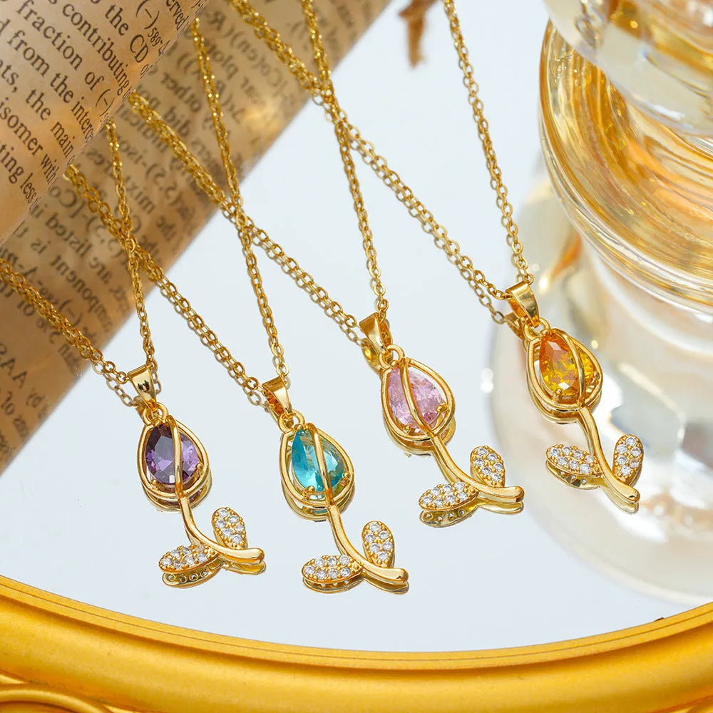 Gold-coloured tulip flower pendant necklace on a titanium steel chain for women.