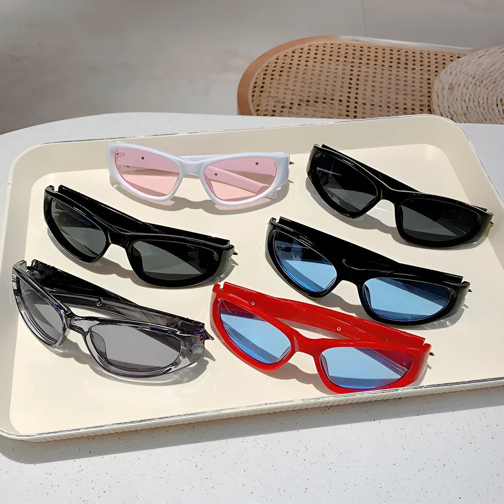 A pair of outdoor sports sunglasses with a PC frame and lens, shown in a black frame with grey lens colour variant.